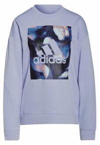 Sweat-shirt lavande clair avec un grand motif abstrait noir et bleu, logo Adidas blanc, poignets côtelés et encolure ronde.