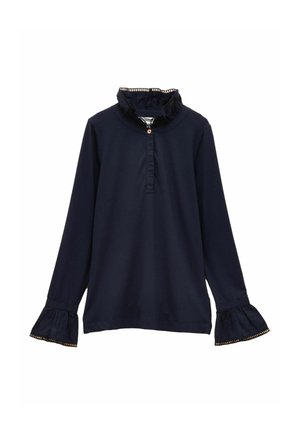 Tmavomodrá blúzka s dlhými rukávmi, volánovým golierom a manžetami, vybavená légou so štyrmi gombíkmi a zlatými ozdobami na rukávoch.