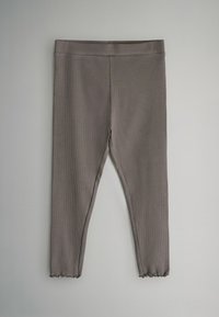 Mallas acanaladas grises con un diseño ajustado, que presentan una cintura suave y un dobladillo con volantes en el tobillo. Tejido suave y elástico.