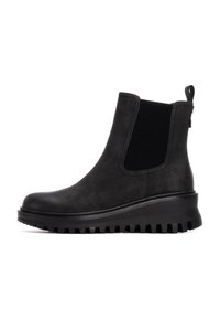 Botas negras hasta el tobillo con material superior suave y mate, paneles laterales elásticos y suela de goma gruesa y estriada para tracción y soporte.