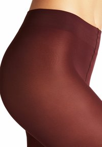 Collant bordeaux con una texture liscia e trasparente, caratterizzati da una vita alta e un sottile motivo a coste lungo le cuciture.