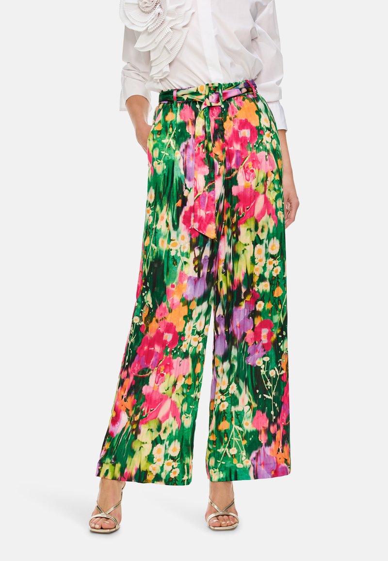 Weite Hosen mit einem lebhaften Blumenmuster in den Farben Pink, Grün und Gelb. Aus leichtem Stoff mit einer gebundenen Taille.