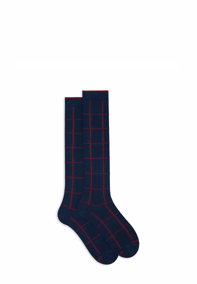Calzini navy con un motivo a griglia rossa, realizzati in un materiale liscio e elastico. Lunghi, con punta senza cuciture e polsini rinforzati.