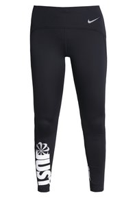 Czarne legginsy sportowe wykonane z elastycznego materiału, z dopasowanym krojem, białym logo "JUST" na lewej nodze oraz małym logo Nike na pasku. 