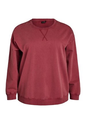 Bordo spalvos megztinis su apvalia iškirpte, pagamintas iš minkštos medvilnės. Turi ilgomis rankovėmis, ribotus rankogalius ir siuvinėtą kryžiaus formos dizainą ant iškirptės.