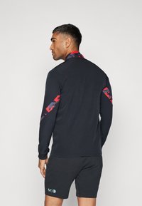 Castore FEYENOORD ROTTERDAM LEAGUE MATCHDAY ANTHEM JACKET - Klub merchandise - caviar/tomato