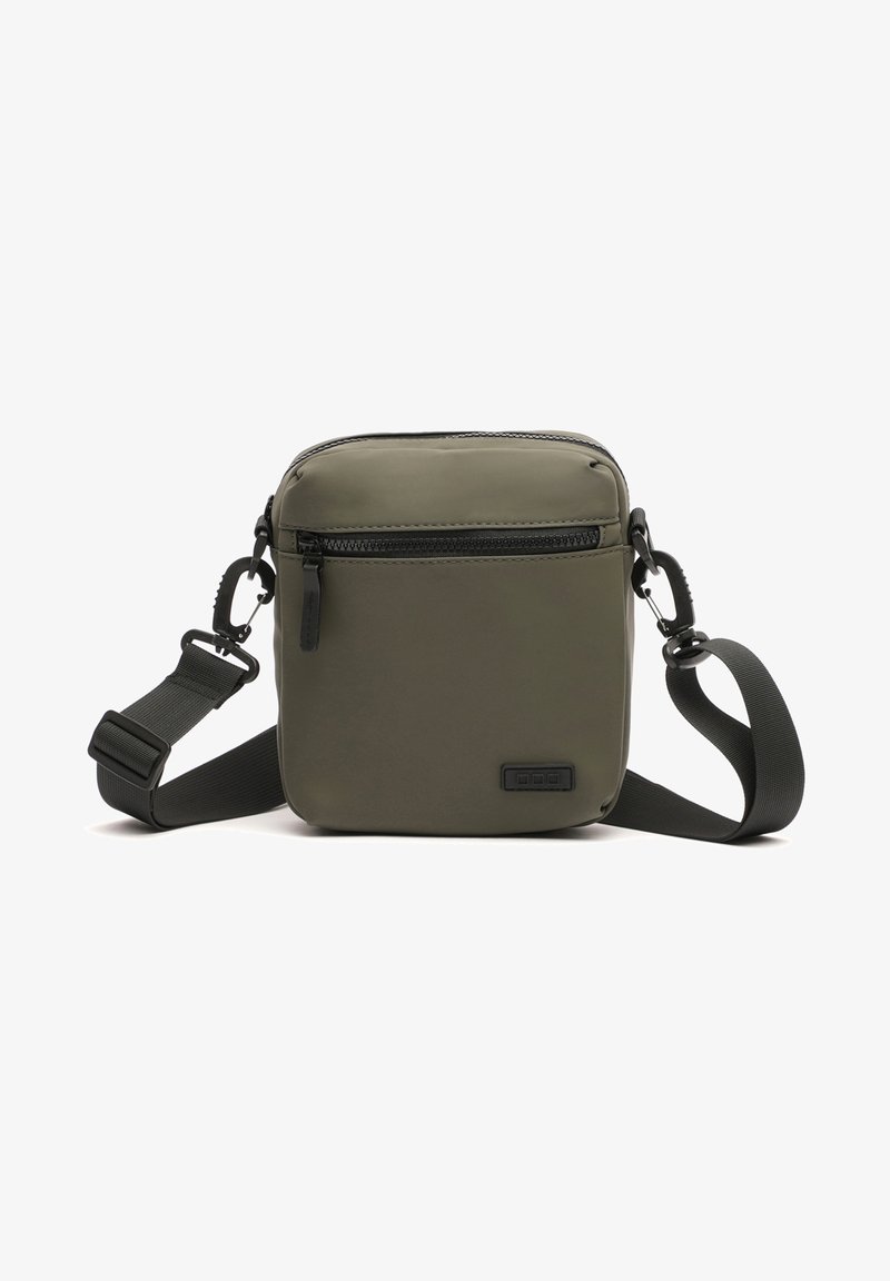 Olive green, square crossbody bag made of smooth, durable material. Features a front zip pocket and adjustable strap for customization.