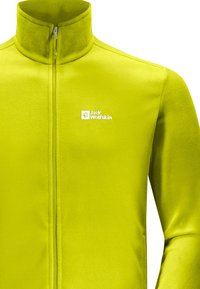 Fleecejacke in helder limoen groen met een hoge kraag, een ritssluiting aan de voorkant en een wit logo op de linkerborst. Zachte textuur en aansluitend ontwerp.