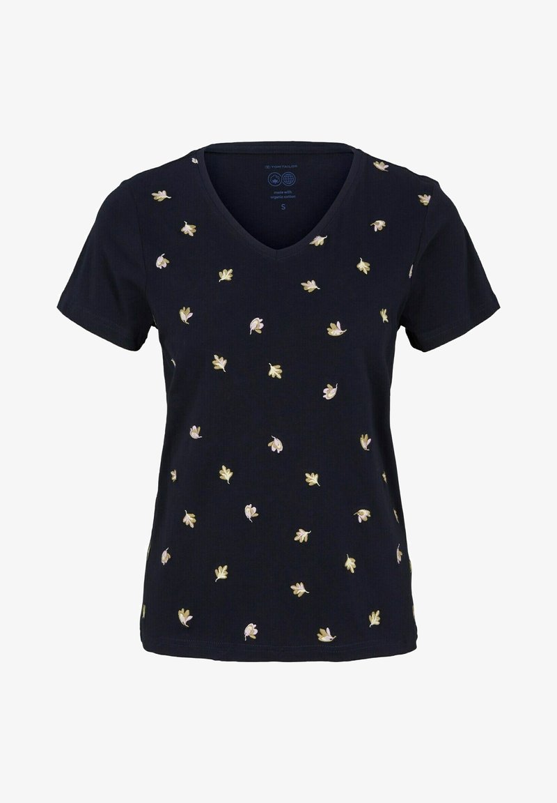 Navy V-ringad t-shirt tillverkad av ekologisk bomull, med spridd blomsterbroderi i krämiga och gröna nyanser. Korta ärmar och rak nederkant.