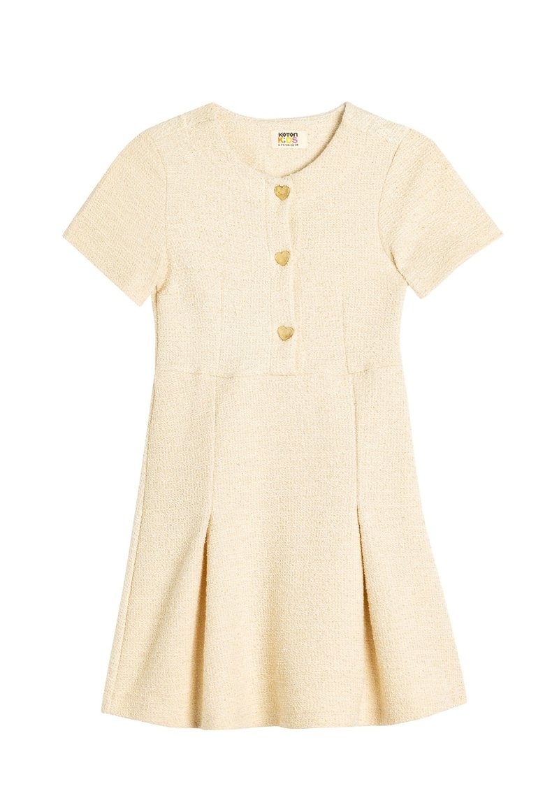 Korte mouw, A-lijn jurk van gestructureerde beige stof met een ronde halslijn, hartvormige knopen en een flared rok met zijplooien.