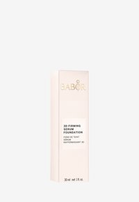 Babor 3D Firming Serum Foundation, 30 ml. Rechteckige, hellrosa Verpackung mit strukturierten Streifen und goldenem Logo. Klare Produktbeschreibung auf der Vorderseite.