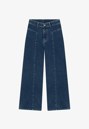 Leveled denim farkut tummassa pesussa, joissa on korkea vyötärö, etutaskut ja sileä pinta. Ompeleet ovat hieman kontrastisia.