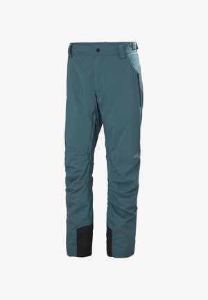 Teal waterproof ski pants with a straight cut, featuring black accents at the hems and side zippers for secure pockets. High-waisted design.