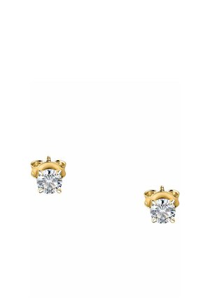 Pair of gold stud earrings each featuring a single round clear gemstone held by four prongs.