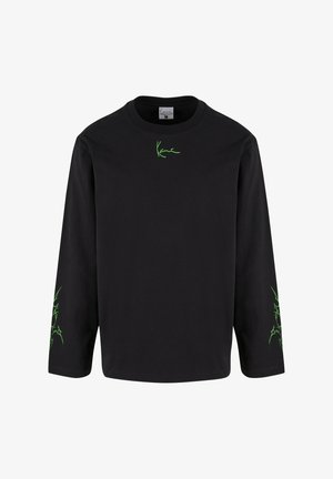 Černé dlouhé rukávy triko vyrobené z bavlny, s zeleným grafickým detailem na hrudi a rukávech. Kulatý výstřih, volný střih.