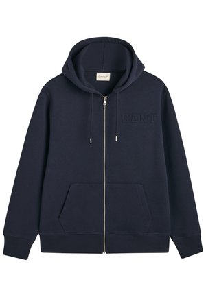 Navy zip-up hoodie made of soft fabric with a hood, front pockets, and GANT logo embossed on the left chest. Smooth texture.