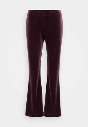 Velvet flared pants in deep purple, featuring an elastic waistband and a smooth, soft texture. Simple design without patterns or accents.