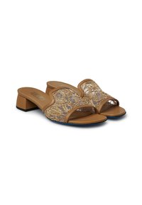 Tan heeled sandals with an open toe design; adorned with intricate gold embroidery over a sheer fabric upper and a smooth beige sole.