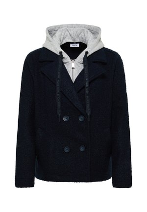 Schwarzer strukturiertes Doppelreiher-Peacoat, der über einem grauen Kapuzenpulli mit Reißverschluss und schwarzen Kordeln getragen wird.