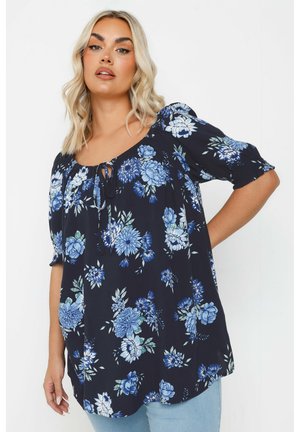 Marinebluse mit blauem Blumenmuster; leichtes Material, Rundhalsausschnitt mit Bindeband, kurze geraffte Ärmel, locker geschnitten.
