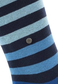 Striped socks featuring alternating dark navy and light blue shades, made of a soft, stretchy material, with a small circular logo near the ankle.