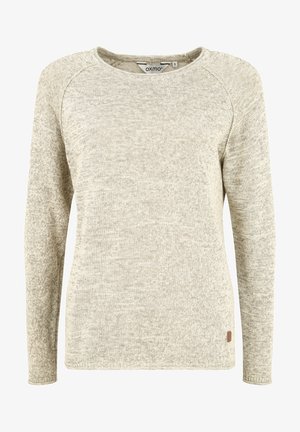Light beige long-sleeve sweater with a textured knit pattern, rounded neckline, and a small branded tag on the lower left side.