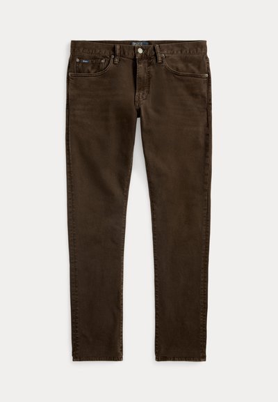 Jeans din bumbac maro, cu tăiere slim, care dispun de cinci buzunare, închidere cu buton metalic și de o ușoară estompare a materialului.