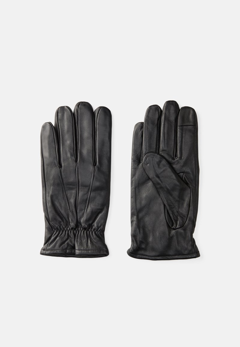 Black leather gloves with five fingers and elasticized wrist. Smooth texture, sleek design, and sewn detailing on the back.