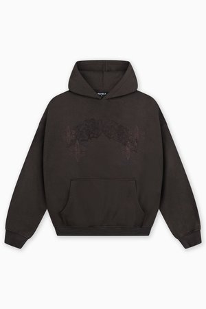 Σκούρο καφέ φούτερ με κουκούλα και μπροστινή τσέπη. Διαθέτει διακριτικό σχέδιο με δαντελωτά μοτίβα και fleur-de-lis σε πιο σκούρα απόχρωση. Μαλακή υφή.