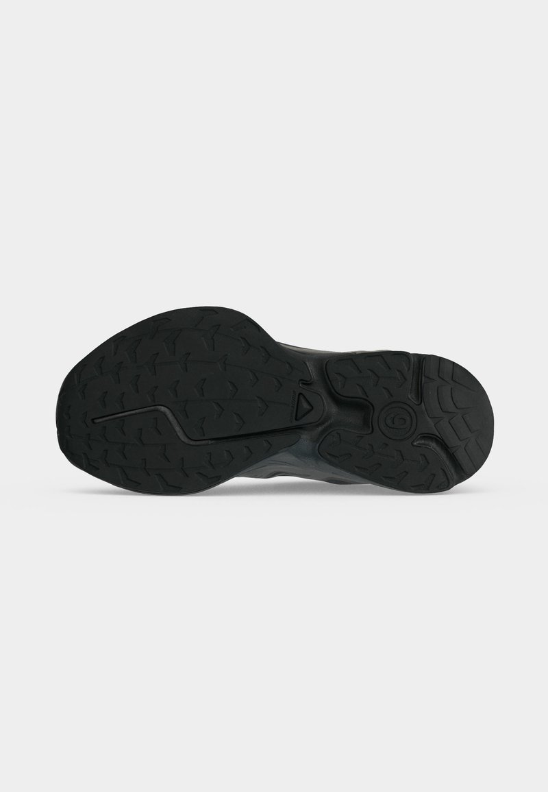 Black rubber sole with textured tread pattern designed for grip, shown flat against a white background.