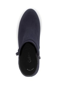 Navy blue suede ankle boot with a smooth texture, round toe, and side zipper detail. Interior features brand logo embossed on the insole.