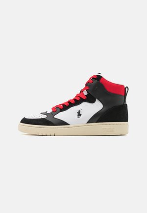 High-top sneakers with a leather upper in black and white, red accents, perforated toe, and a contrast rubber sole featuring branding.
