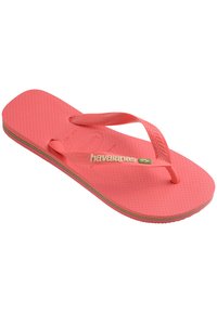 Ružová gumová šľapka s textúrovanou stielkou a tenkými popruhmi. Obsahuje značku Havaianas a multicolorovú podrážku.