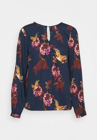 Blusa blu navy con maniche lunghe, caratterizzata da un motivo floreale nei toni del rosa e dell'arancio. Dettaglio a chiave sul retro, tessuto morbido.