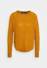 Senapsgul stickad tröja med långa ärmar, rund halsringning och strukturerad öppen stickning.