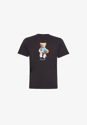 Black cotton t-shirt featuring a graphic of a bear in a blue sports jersey holding a basketball, with white sneakers on its feet.