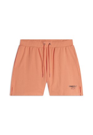 Shorts orange clair en tissu doux, avec une taille élastique, un cordon de serrage, des fentes sur les côtés et un petit logo métallique sur l'ourlet gauche.