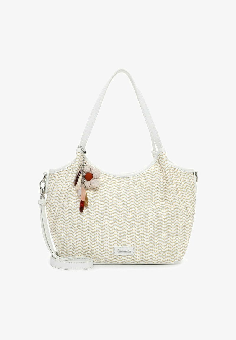 Sac fourre-tout blanc avec motif zigzag beige, poignées blanches, bandoulière amovible et charm floral avec perles multicolores attaché à une poignée.