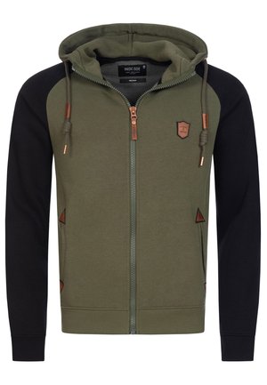 Sudadera con cremallera en verde oliva y mangas negras, con herrajes en bronce, un parche de logo y acentos triangulares. Fabricada en una suave mezcla de algodón.