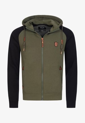 Olive green zip-up hoodie with black sleeves, featuring bronze hardware, a logo patch, and triangular accents. Made from soft cotton blend.