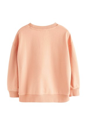 Persikofärgad sweatshirt med rund halsringning, avslappnad passform, sänkta axlar och ribbad nederkant och ärmslut. Mjuk tyg med slät textur.