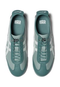 Teal and light gray leather sneakers with white accents, rounded toe, and lace-up design. Includes padded tongue and branded insole.