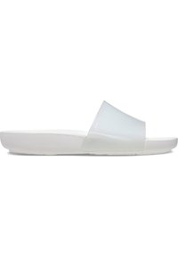 Translucent slide sandals with a wide strap, white rubber sole, and a smooth matte finish. Minimalist design in light colors.