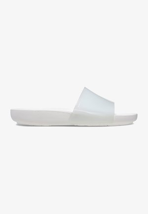 Translucent slide sandals with a wide strap, white rubber sole, and a smooth matte finish. Minimalist design in light colors.