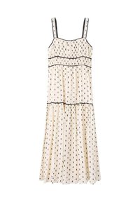 Vestido de color crema con finos patrones negros, tirantes delgados, falda en capas y ribete negro en el corpiño y el dobladillo.