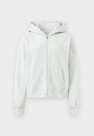 Grå blixtlås hoodie i mjukt tyg, med huva, framfickor och ribbade muddar och nederkant. Slät yta med minimal detaljer.