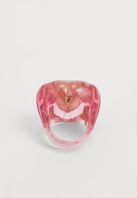 Transparent pink resin ring with a smooth, rounded shape and a hollow center. Features a subtle gradient from light to darker pink.