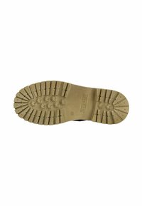 Suela de zapato negra con una gruesa suela exterior de goma marrón texturizada que presenta surcos profundos para un buen agarre y una zona central lisa con la marca.