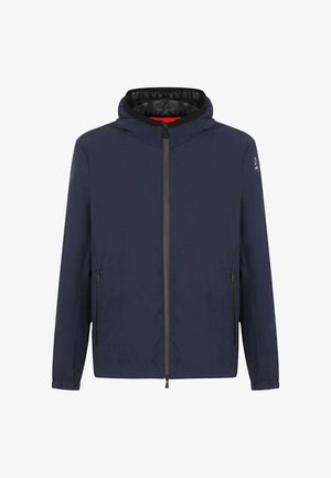 Giacca blu navy con cappuccio, zip frontale completa, due tasche laterali con zip e polsini elasticizzati, con un rivestimento interno a contrasto.
