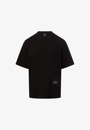 Schwarzes Baumwoll-T-Shirt mit rundem Ausschnitt, kurzen Ärmeln und einem seitlichen Etikett mit weißem Text auf einem rechteckigen Aufnäher.